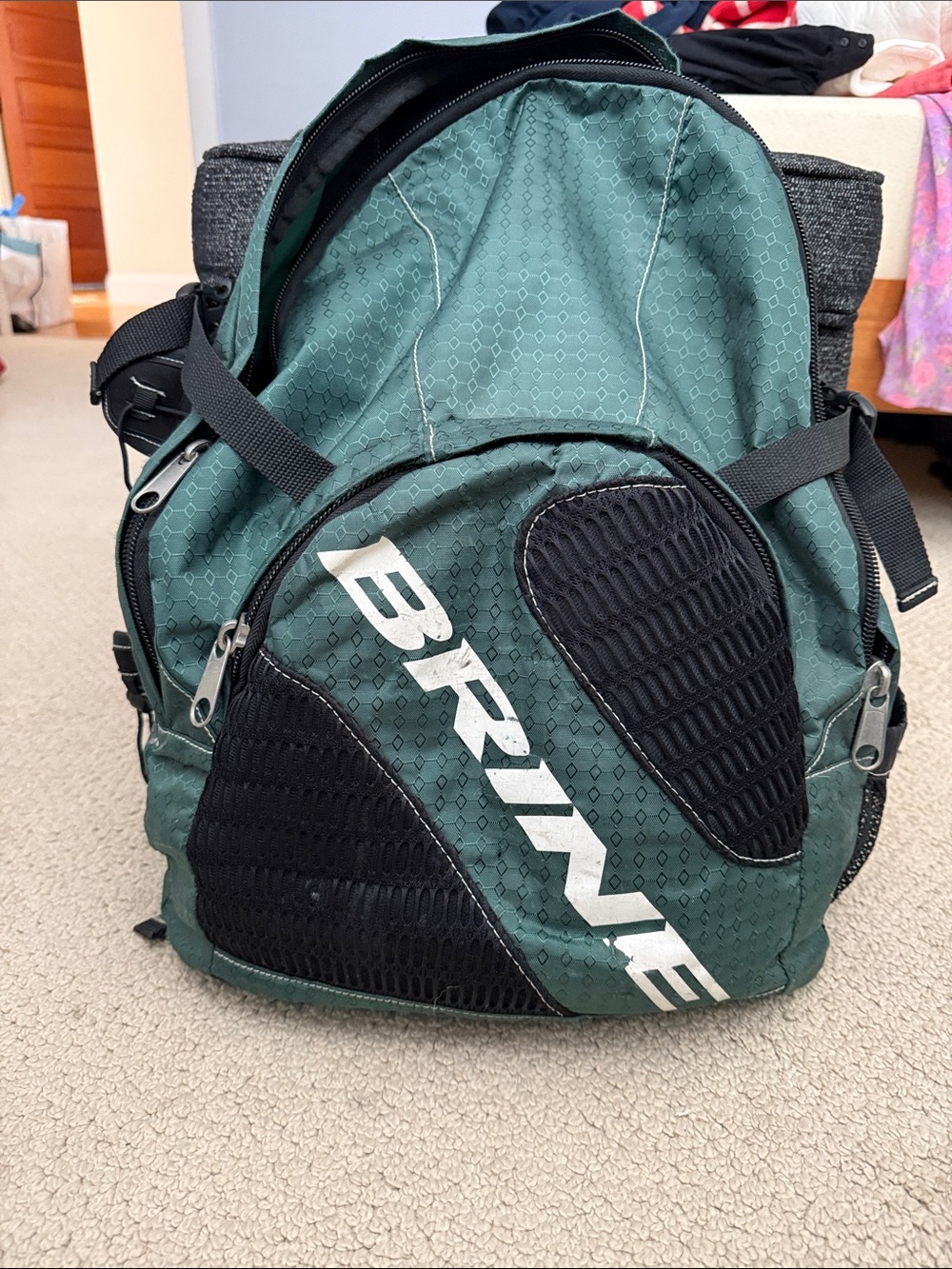 Brine Green and Black Sports Backpack. 2 pockets with Stick Holder